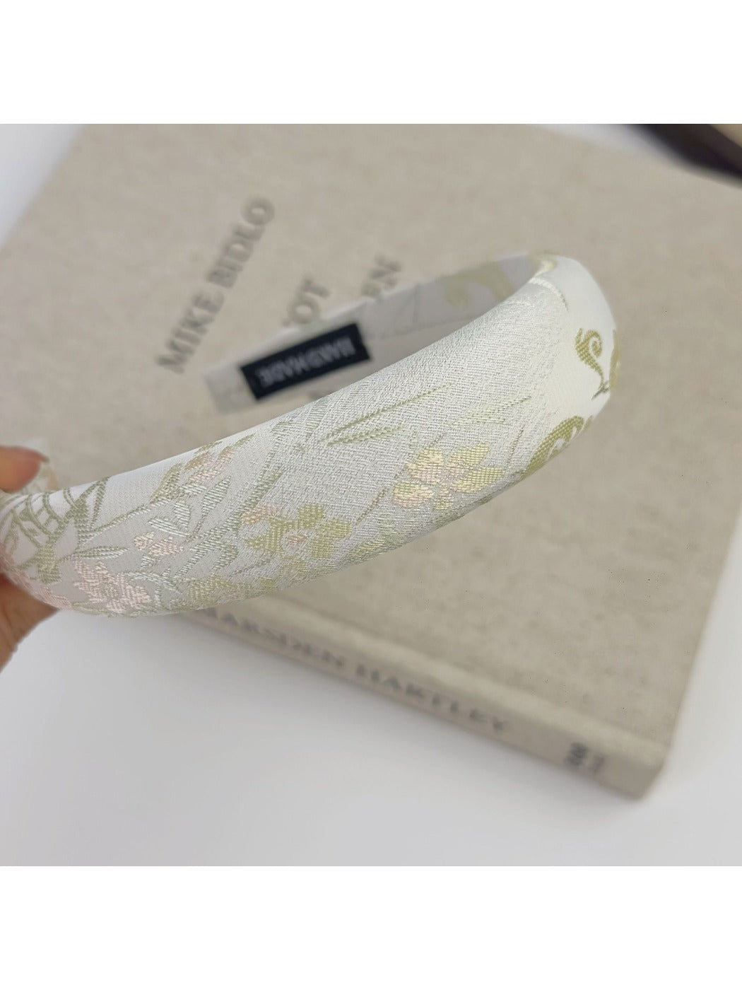 Gifty flower headband with pink, white, and green embroidered floral design