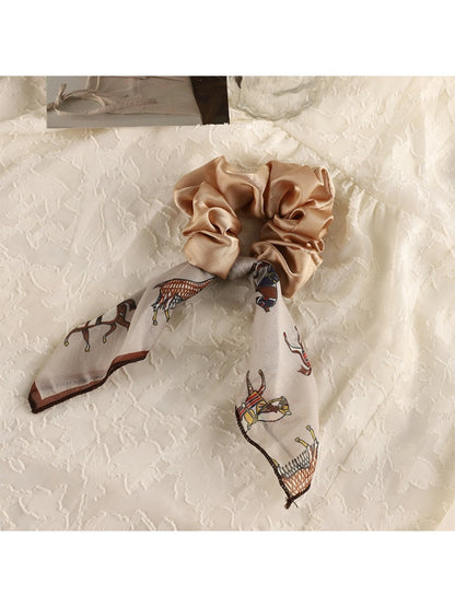 Vintage satin bow hair scrunchie displayed flat with bow detail visible