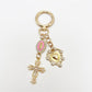 Detailed shot of the cross pendant's textured metal design