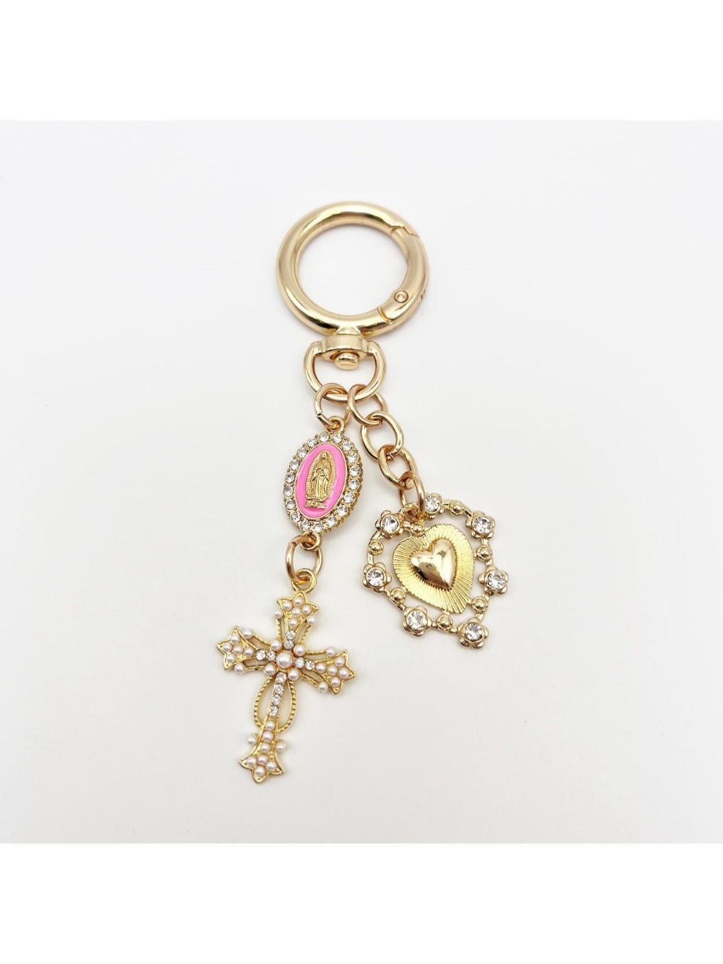 Detailed shot of the cross pendant's textured metal design
