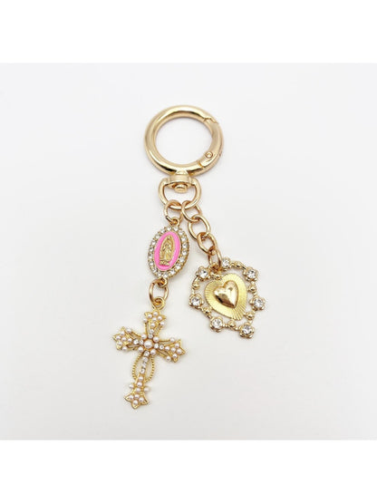 Detailed shot of the cross pendant's textured metal design