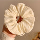 Gifty minimalist floral print scrunchie packaged in a simple branded box