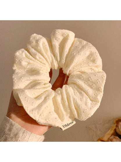 Gifty minimalist floral print scrunchie packaged in a simple branded box