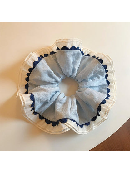 Close-up of Gifty elegant color block ruched scrunchie in soft pastel shades