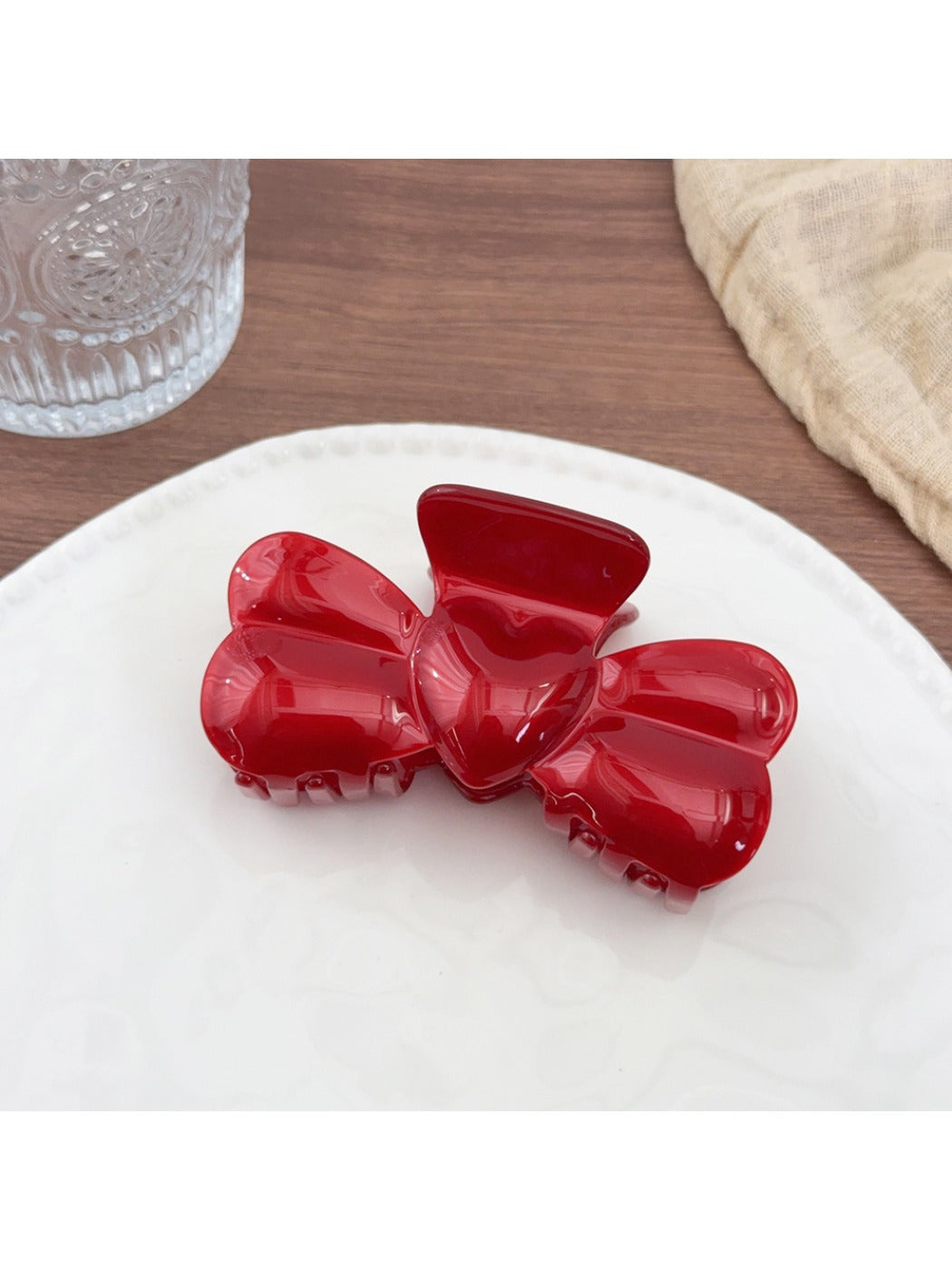 Beau hair claw clip holding thick brown hair in an updo style