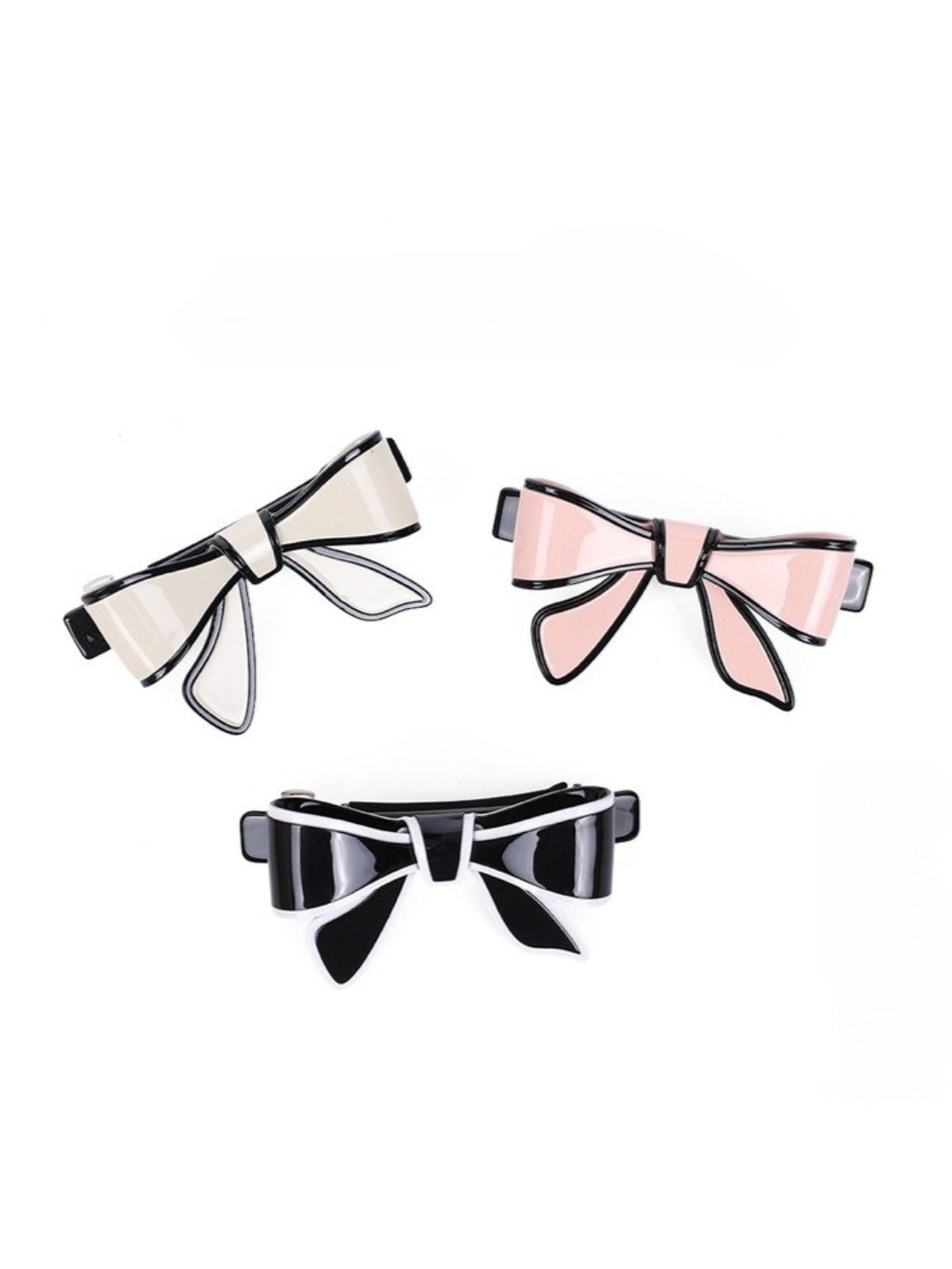 Side view of Beau bow hair clip highlighting its curved shape and clasp