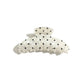 Beau polka dot updo claw clip displayed on a white background
