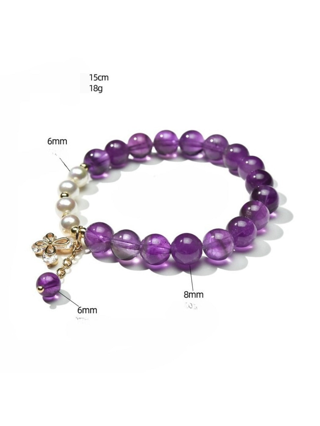 Close-up of silver spacer beads between purple crystals on bracelet