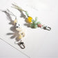 Keypus acrylic beaded flower keychain hanging from a silver keyring