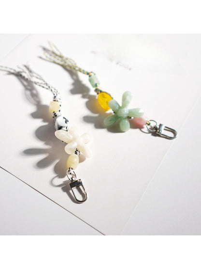 Keypus acrylic beaded flower keychain hanging from a silver keyring