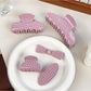 Side view of Beau sweet pink hair claw clip with white polka dots