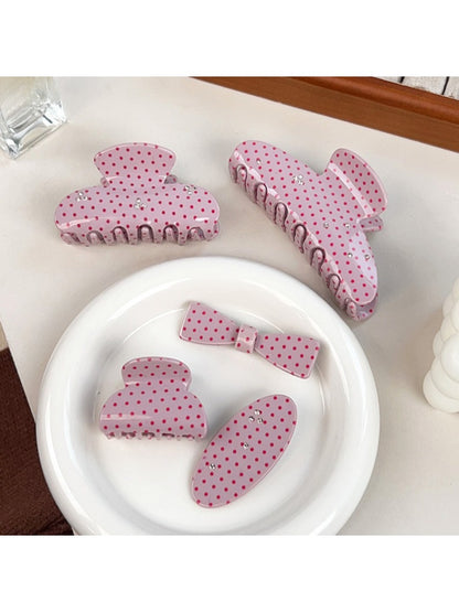 Side view of Beau sweet pink hair claw clip with white polka dots