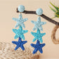 Earedge star pendant earrings packaged in a branded jewelry box