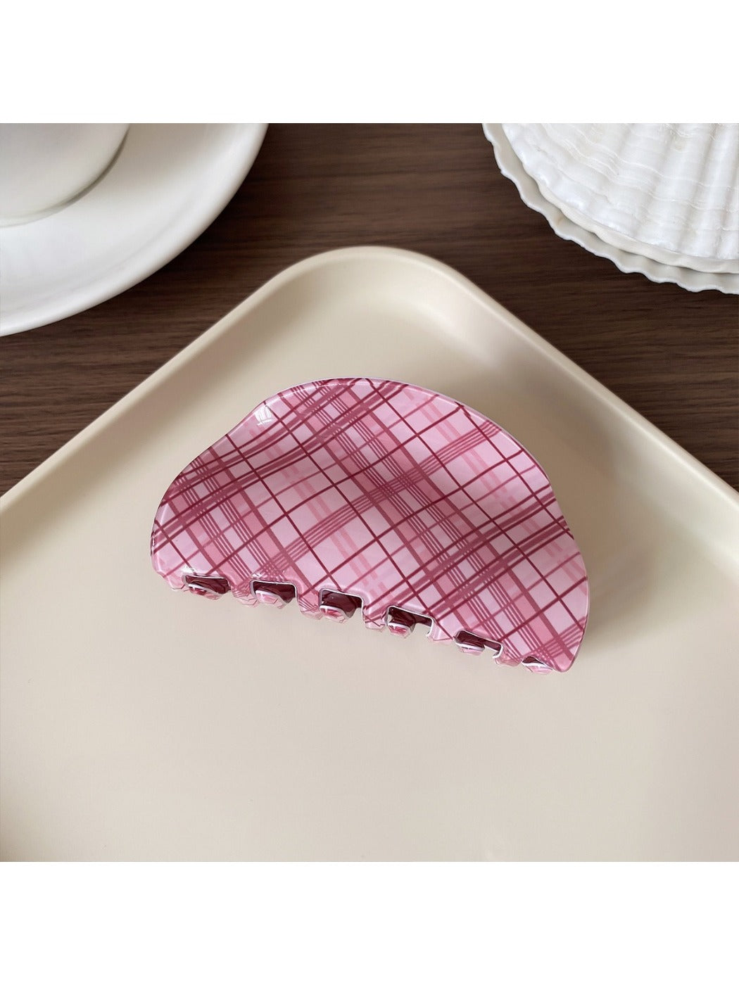 Top view of Beau pink plaid hair claw clip showing curved shape
