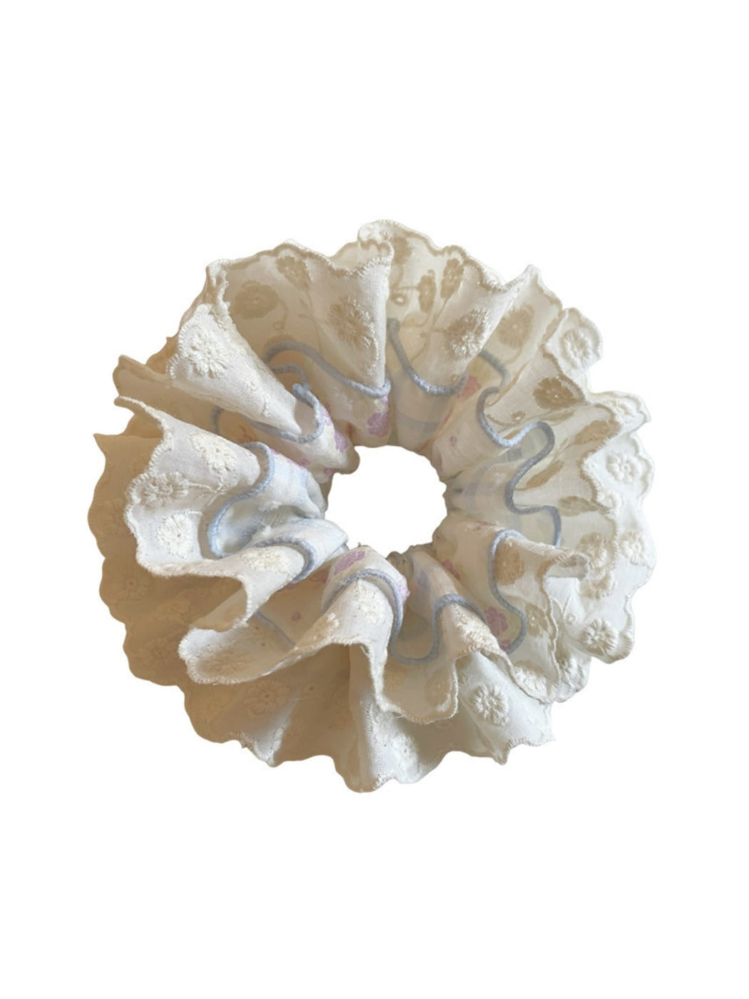 Blue lace double scrunchie styled on a wrist as a fashion accessory