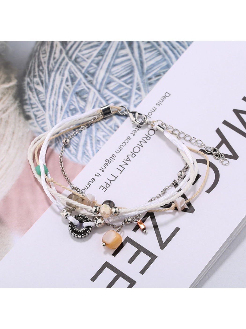 Lovra small bead alloy bracelet displayed on a hand model