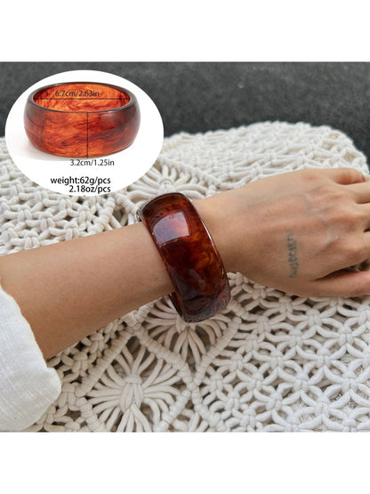 Lovra ombre bangle bracelet paired with casual outfit on model's arm