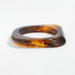 Lovra vintage ombre wide band bangle bracelet angled to show thickness and color