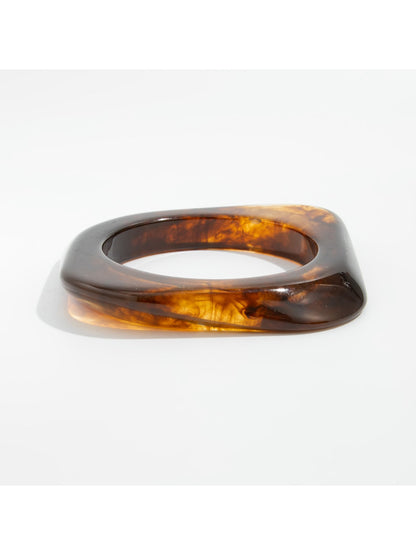 Lovra vintage ombre wide band bangle bracelet angled to show thickness and color