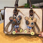 Close-up of the bear shaped keychain showing detailed facial features and texture