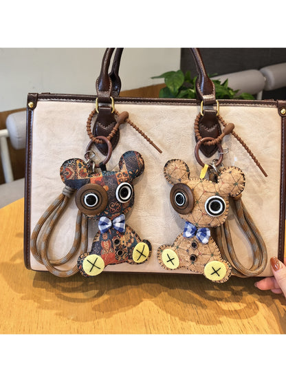Close-up of the bear shaped keychain showing detailed facial features and texture