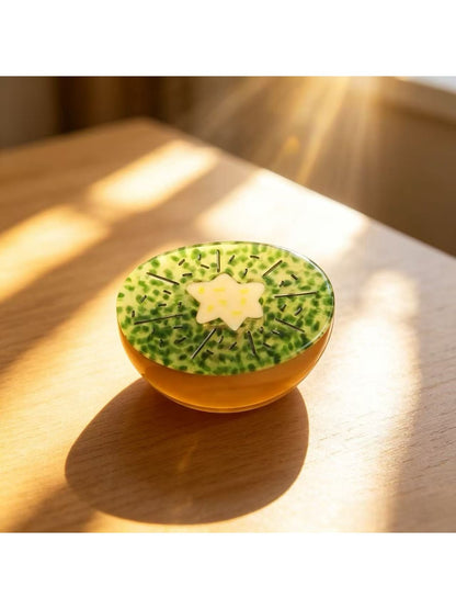 Beau fruit shaped claw clips displayed on a white surface with natural lighting