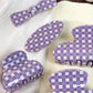 Close-up of purple plaid pattern on Beau hair claw clip
