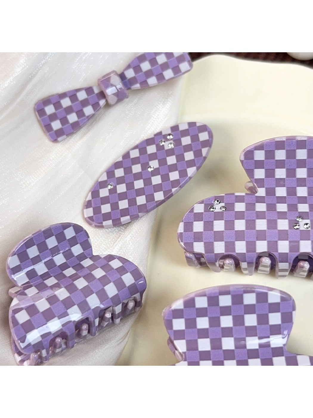 Close-up of purple plaid pattern on Beau hair claw clip