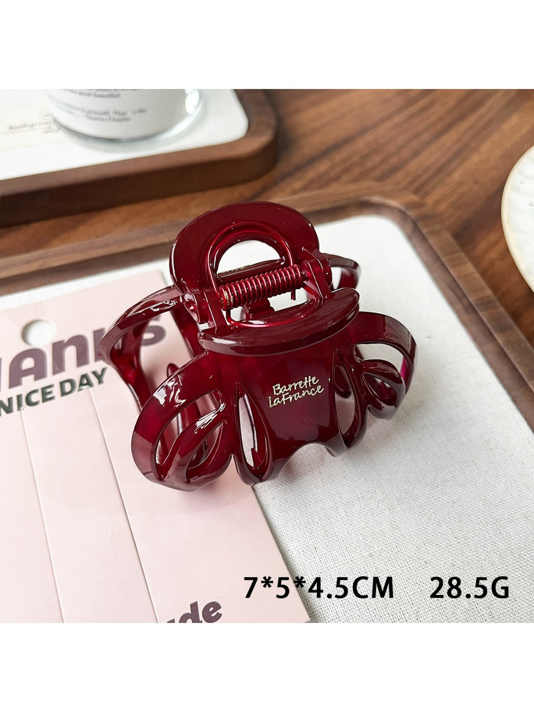 Beau claw clip in matte beige, angled view highlighting minimalist style