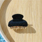 Top view of Beau claw clip highlighting black glitter and leopard design
