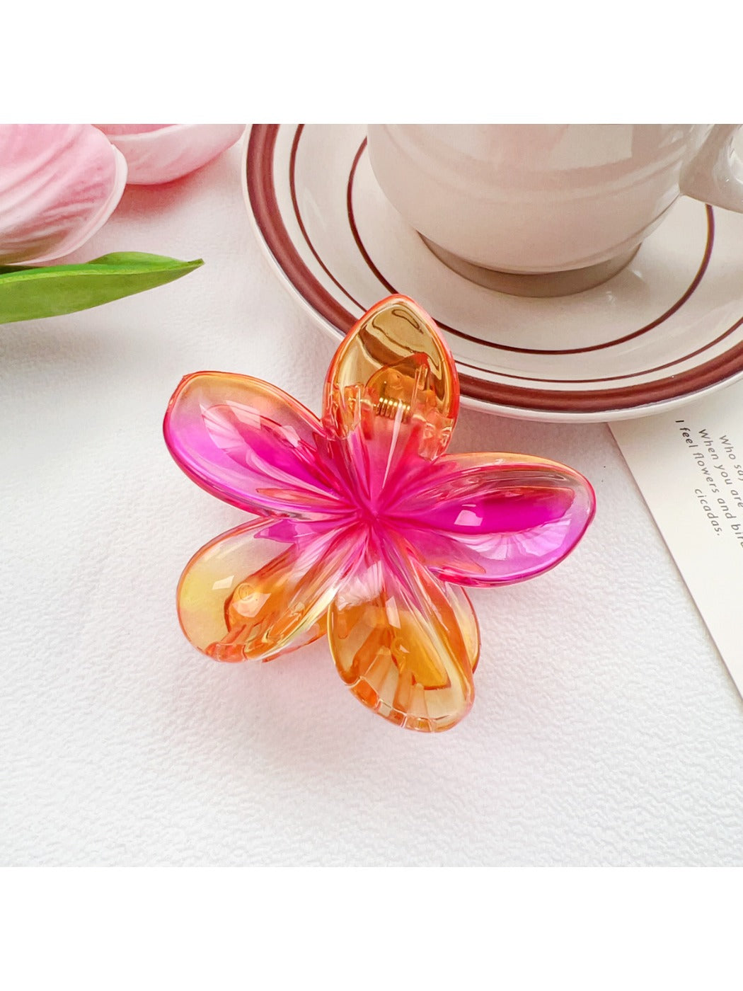 Beau flower claw clip with glossy finish and vibrant multicolor petals