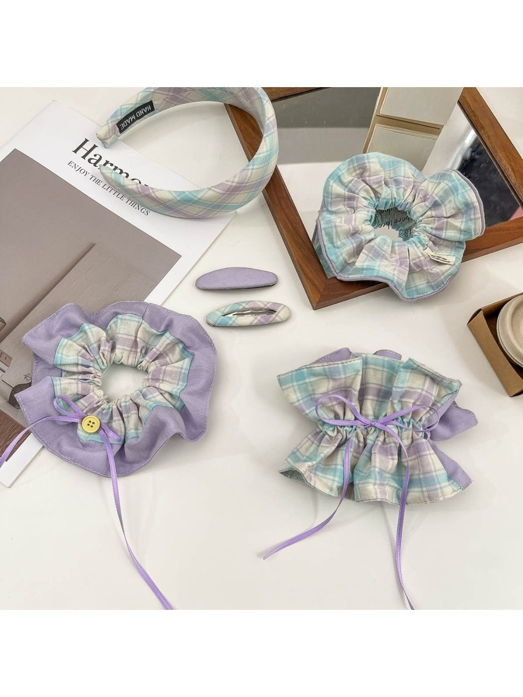 Plaid hair clip featuring a bow design with metal clasp