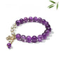 Close-up of Lovra vintage butterfly beaded bracelet with colorful beads and butterfly charm