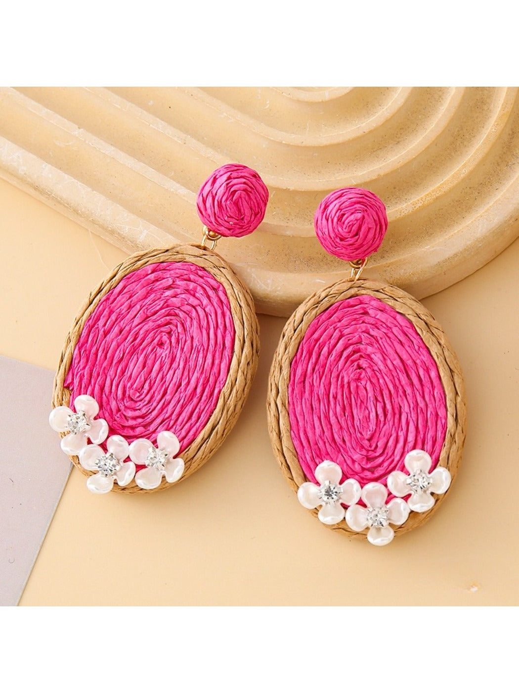 Model wearing Earedge raffia woven oval shape earrings with casual outfit