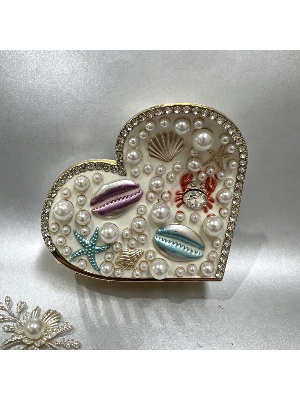 Beau hair clip resting on a wooden surface with natural light