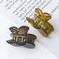 Side view of Beau cherry shaped claw clip highlighting the clip mechanism