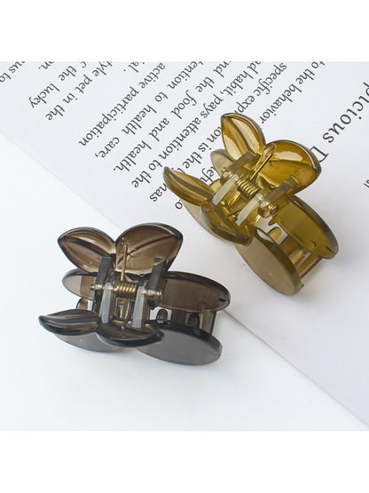 Side view of Beau cherry shaped claw clip highlighting the clip mechanism