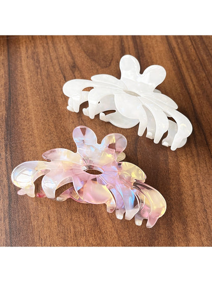 Side view of Beau sweet chic flower claw clip highlighting clip mechanism