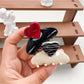Close-up of Beau medium heart shaped half circle claw clip showing metal spring mechanism