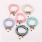 Close-up of Lovra chic colorful layered beaded bracelet with multicolored beads