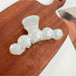 Top view of Beau hair claw clip showing symmetrical wavy pattern