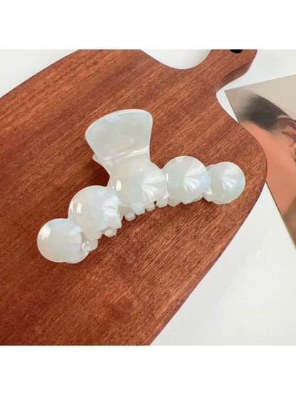 Top view of Beau hair claw clip showing symmetrical wavy pattern