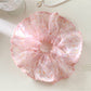 Close-up of Gifty vintage scrunchie showing detailed floral print and fabric texture