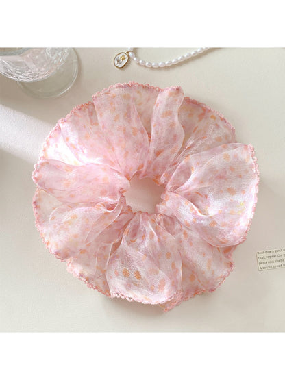 Close-up of Gifty vintage scrunchie showing detailed floral print and fabric texture