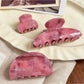 Beau hair claw clip held in hand displaying size and ombre color transition