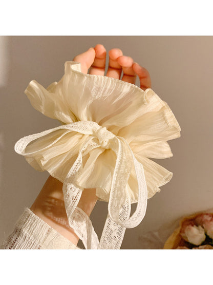 Gifty solid color bow scrunchie in lavender purple with smooth fabric finish