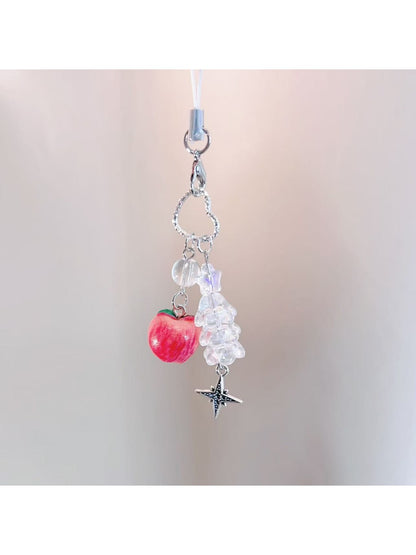 Red apple keychain displayed on a white background highlighting its compact size