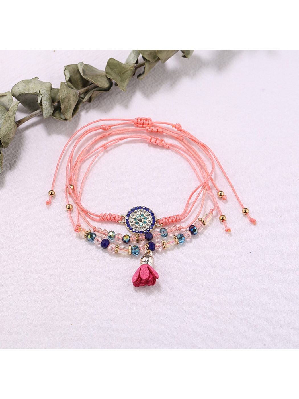 Lovra small bead tassel alloy bracelet styled with casual outfit on wrist
