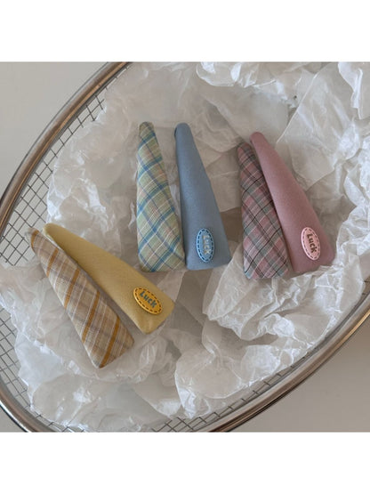 Side view of Beau colorful oval hair clip highlighting its curved shape and clasp