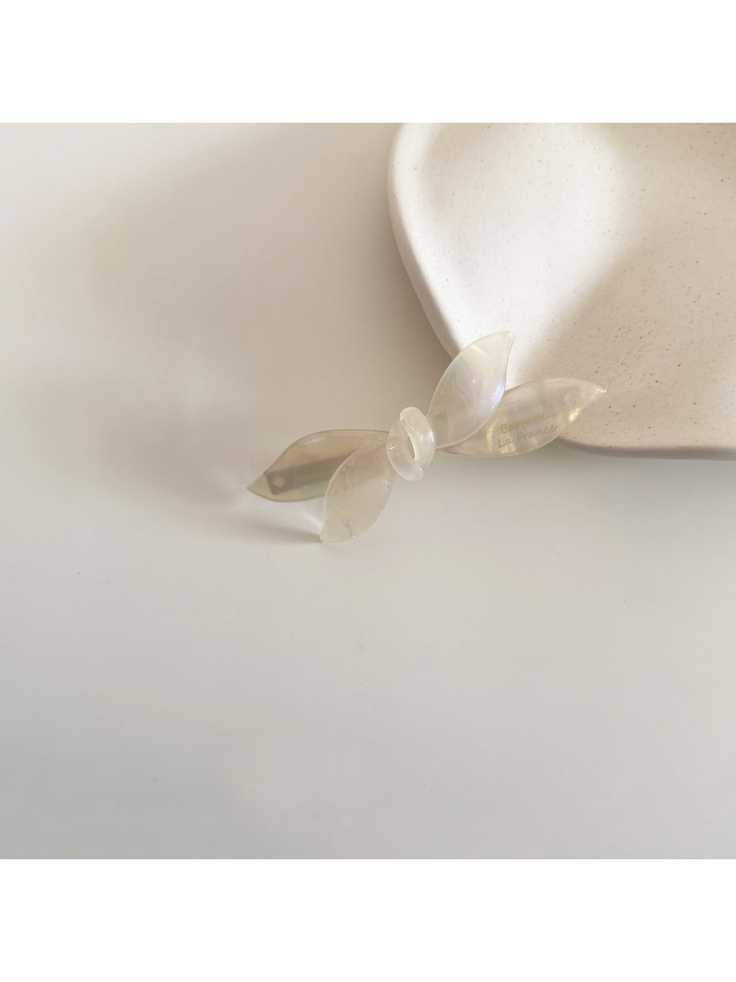 Beau retro bow hair clip held in hand showing size and detail